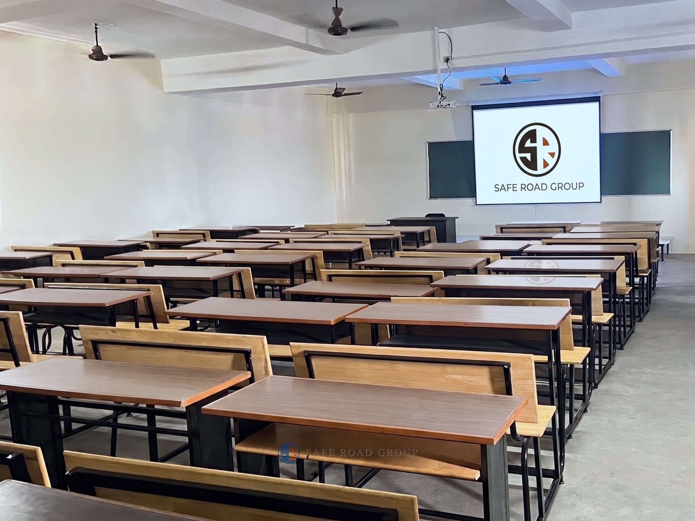 The classroom block, benches set out facing the screen